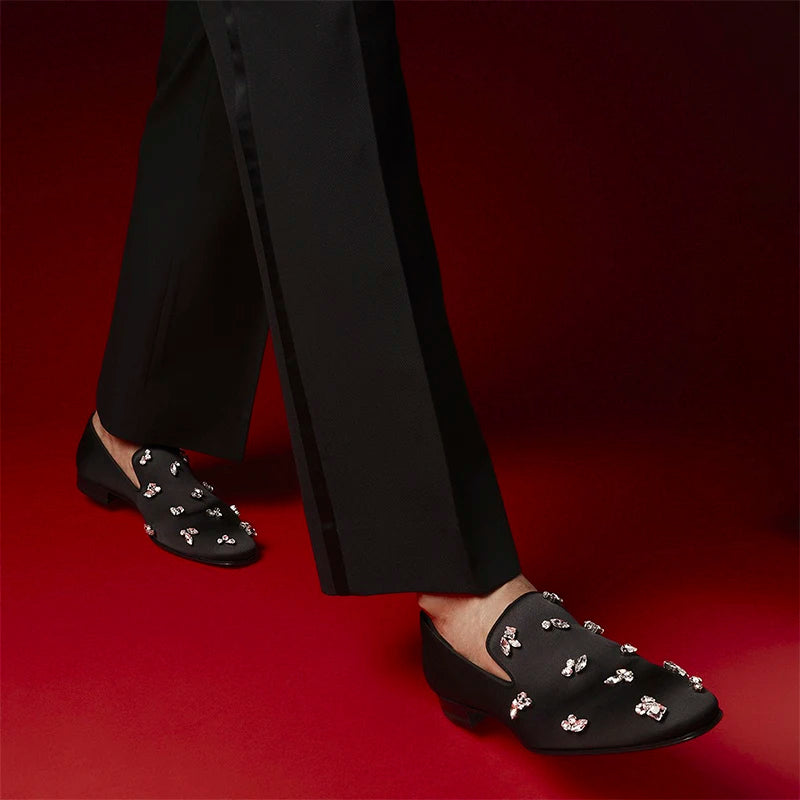 The same design red outsole moccasins with a smooth black crepe satin men's loafer.