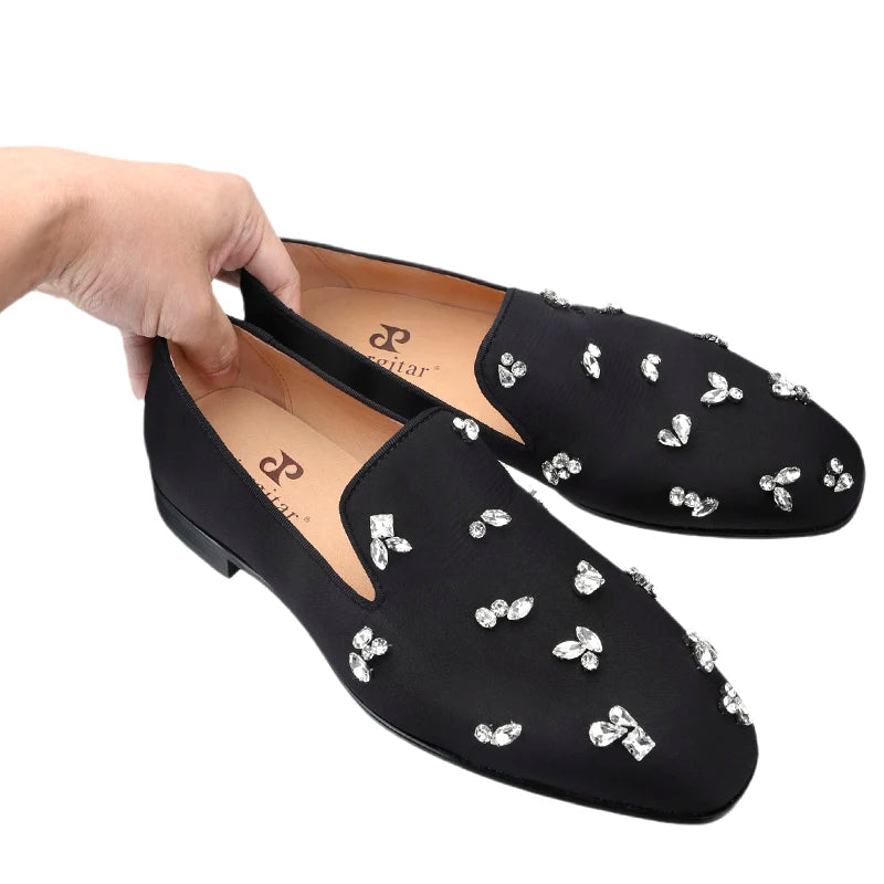 The same design red outsole moccasins with a smooth black crepe satin men's loafer.