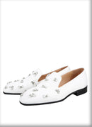 The same design red outsole moccasins with a smooth black crepe satin men's loafer.