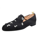 The same design red outsole moccasins with a smooth black crepe satin men's loafer.